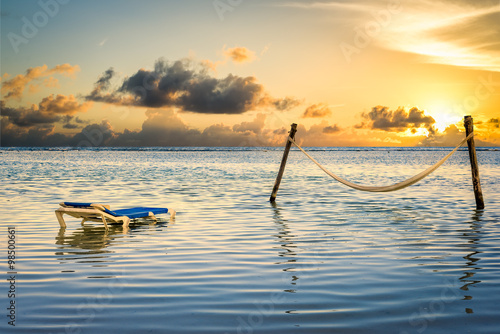 Fototapeta Naklejka Na Ścianę i Meble -  Hammock and Lounge Chair in the Ocean