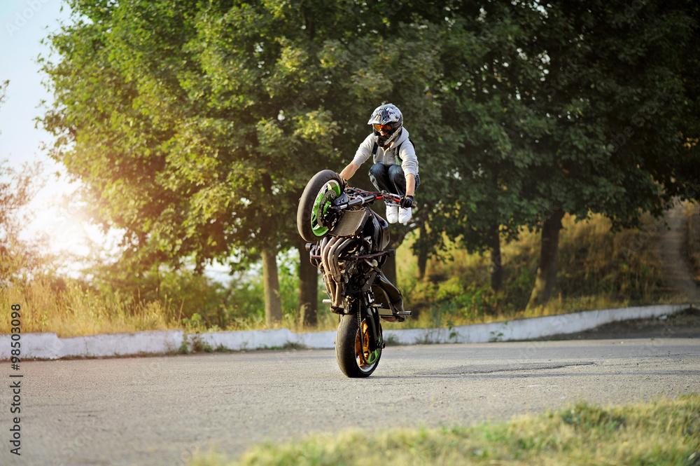 Obraz premium Training hard. Action soft smudged focus shot of a stuntman doing a trick on his motorbike copyspace on the side