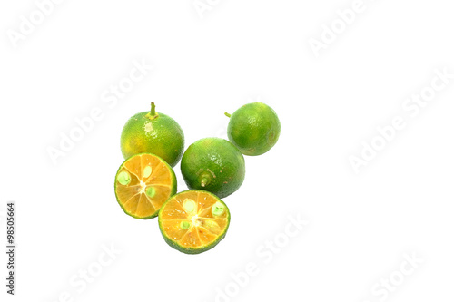 Calamondin or calamansi lime on a white background. photo