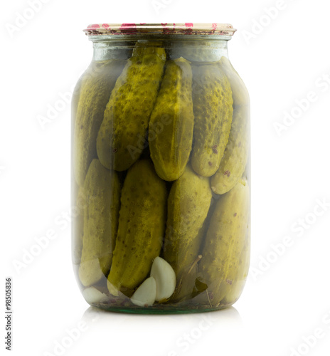 Marinated cocumbers canned in glass jar isolated on the white ba