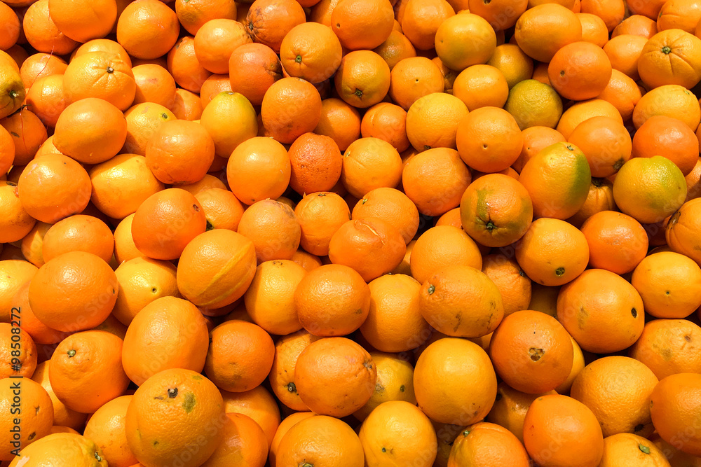 Colorful Display Of Oranges In Fruit Market