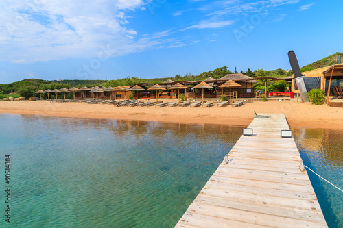 A wooden pier on Santa Manza beach  Corsica island  France