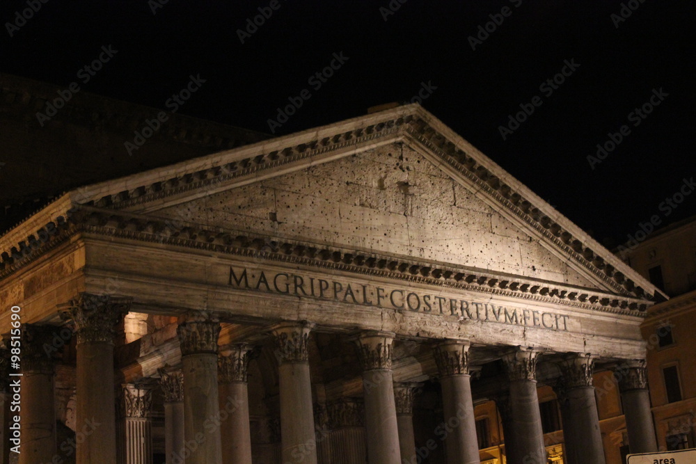 Pantheon pediment close up at night in Rome, Italy