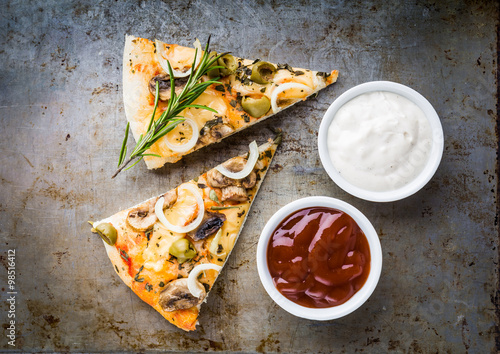 Pieces vegetarian pizza with mushrooms, olives and onions