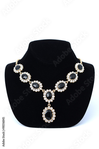 necklaces with gems on a mannequin isolated on white