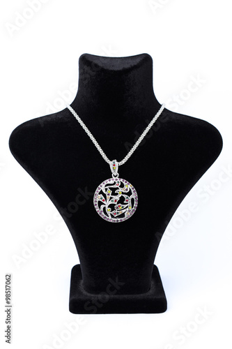 circular pendant on a mannequin isolated on white