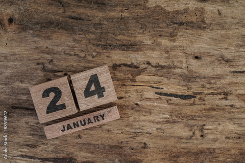 wooden cube calendar for january on wooden surface with copy space