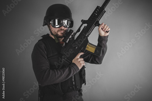 gunpowder, airsoft player with gun, helmet and bulletproof vest
