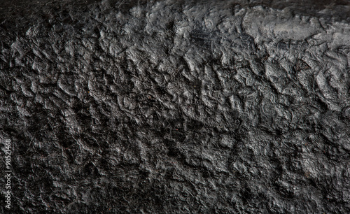 Macro shot of bottom of old cast iron frying pan