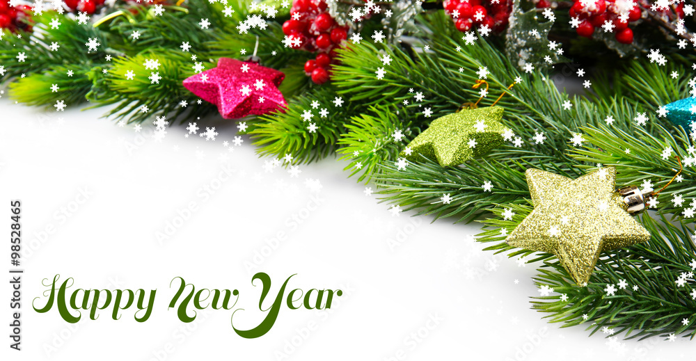 Christmas tree branch with red berries and decorations on white background Christmas tree branch with red berries and decorations on white background