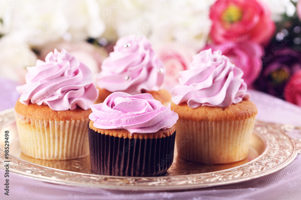 Tasty cupcakes on bright background Tasty cupcakes on bright background