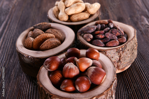 Assortment of tasty nuts on wooden background