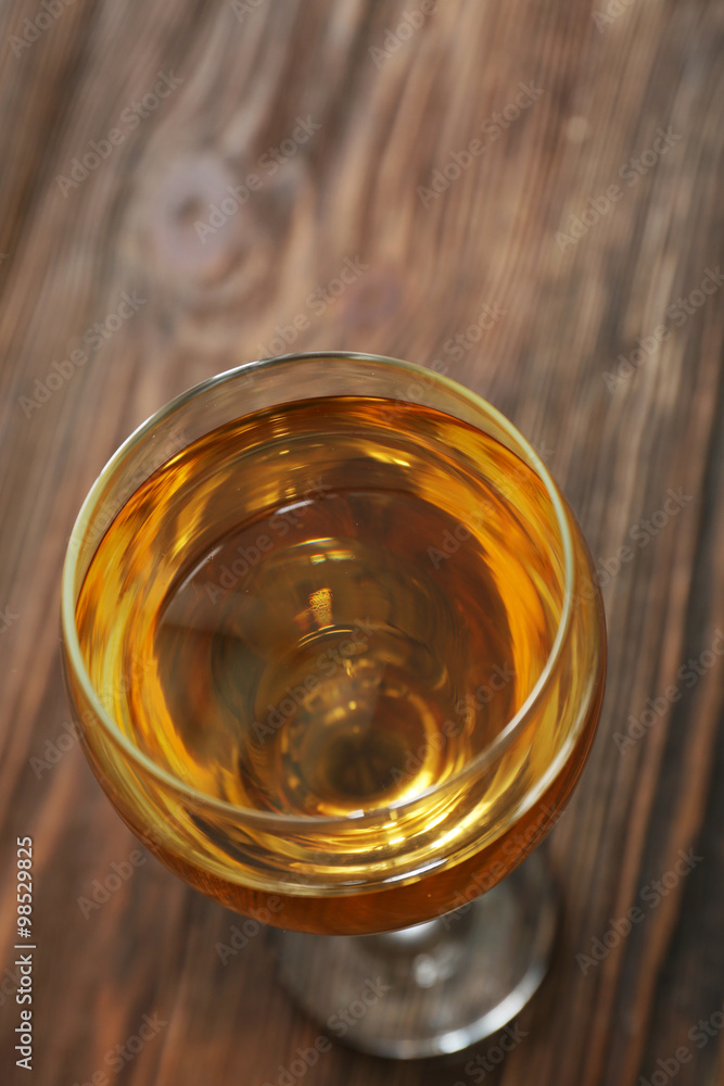 Glass of wine on wooden table. Top view Glass of wine on wooden table. Top view