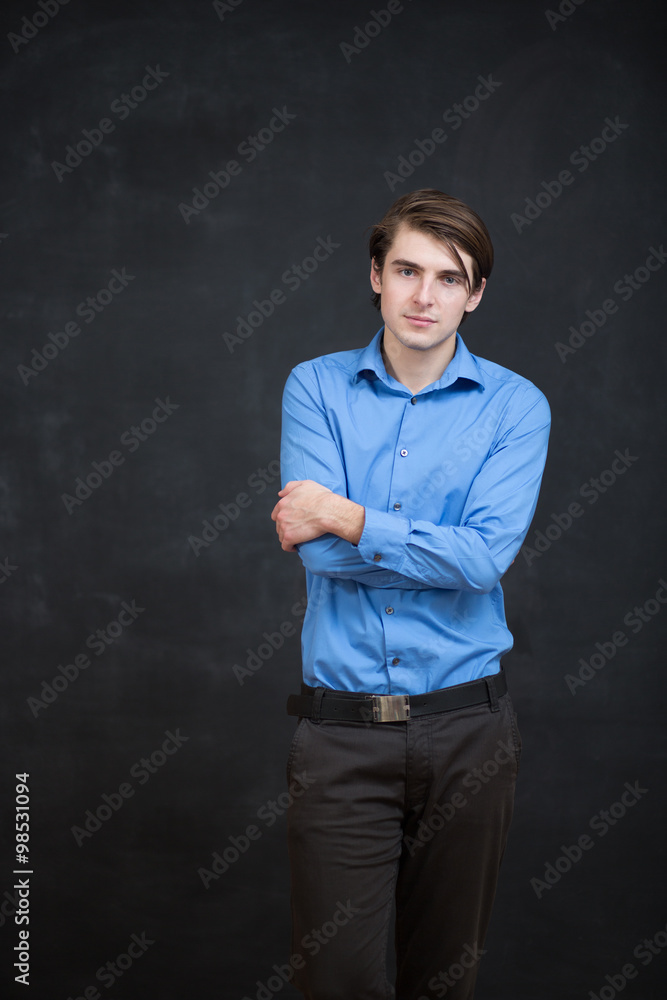 Portrait of a man in front of a chalkboard Portrait of a man in front of a chalkboard
