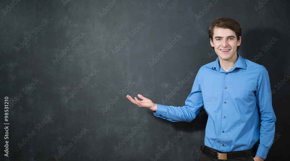 Social network concept. Young man is pointing on something, on d Social network concept. Young man is pointing on something, on d