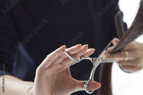 The hands of the hairdresser to have a pair of scissors