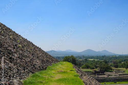 Grassy pathway and closeup of pyramid's wall at Teotihuacan 