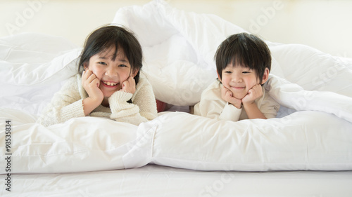 Cute asian children lying