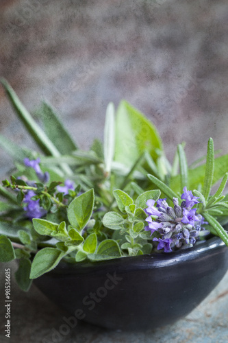 Bowl of Fresh Herbs with Grunge Effects photo