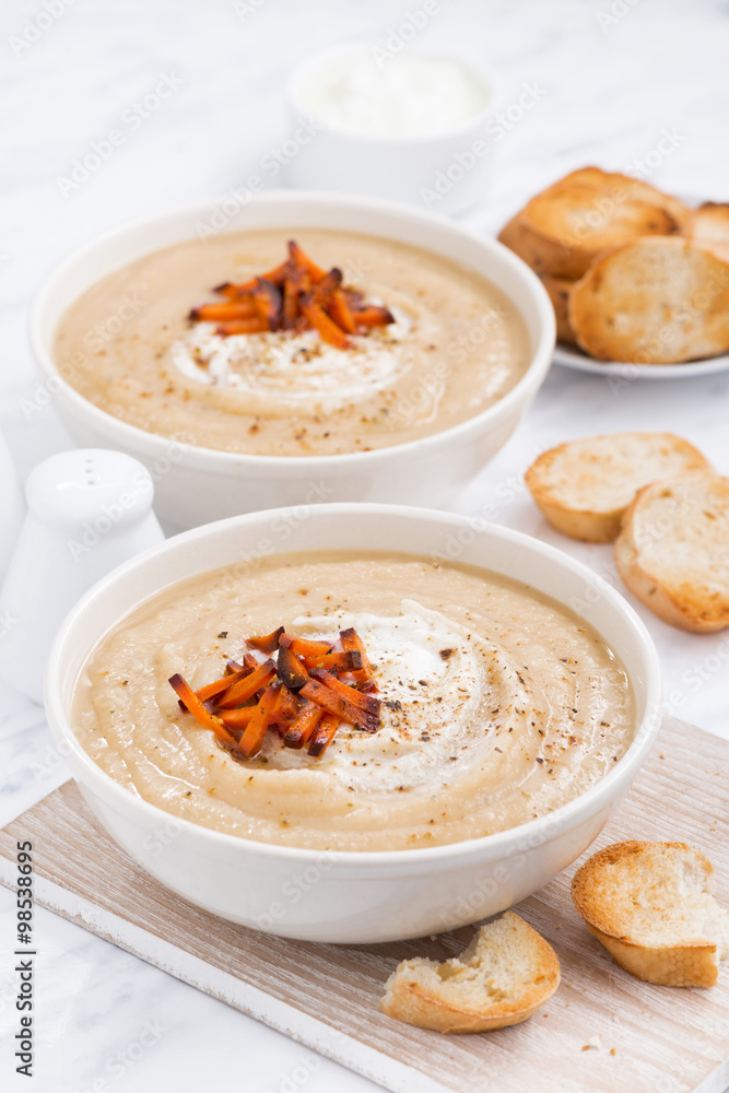 cream soup with caramelized carrots, vertical