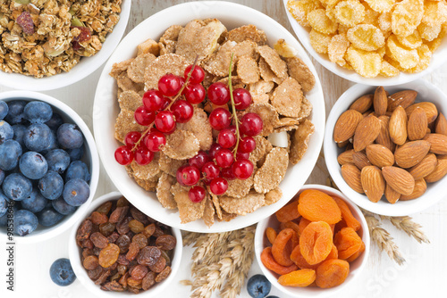 assortment of different breakfast cereal, dried fruit 
