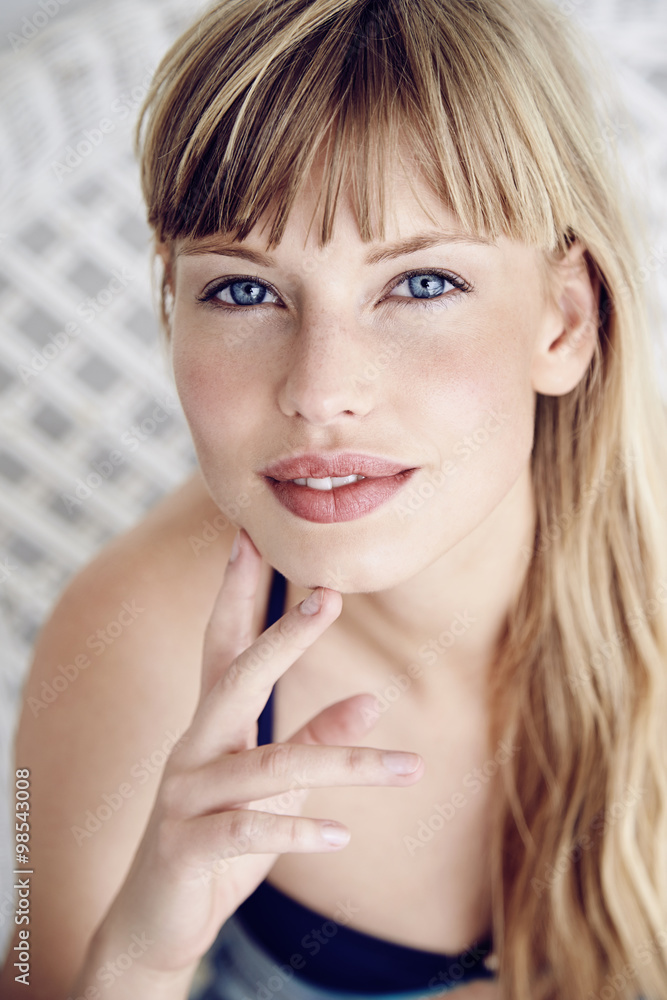 Stunning blue eyed young woman looking at camera Stunning blue eyed young woman looking at camera