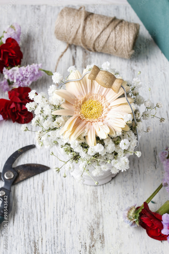 Floral arrangement with peach gerbera flower and gypsophila pani