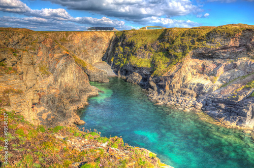 Beautiful Cornwall north coast turquoise blue sea Pepper Cove near Treyarnon in colourful HDR