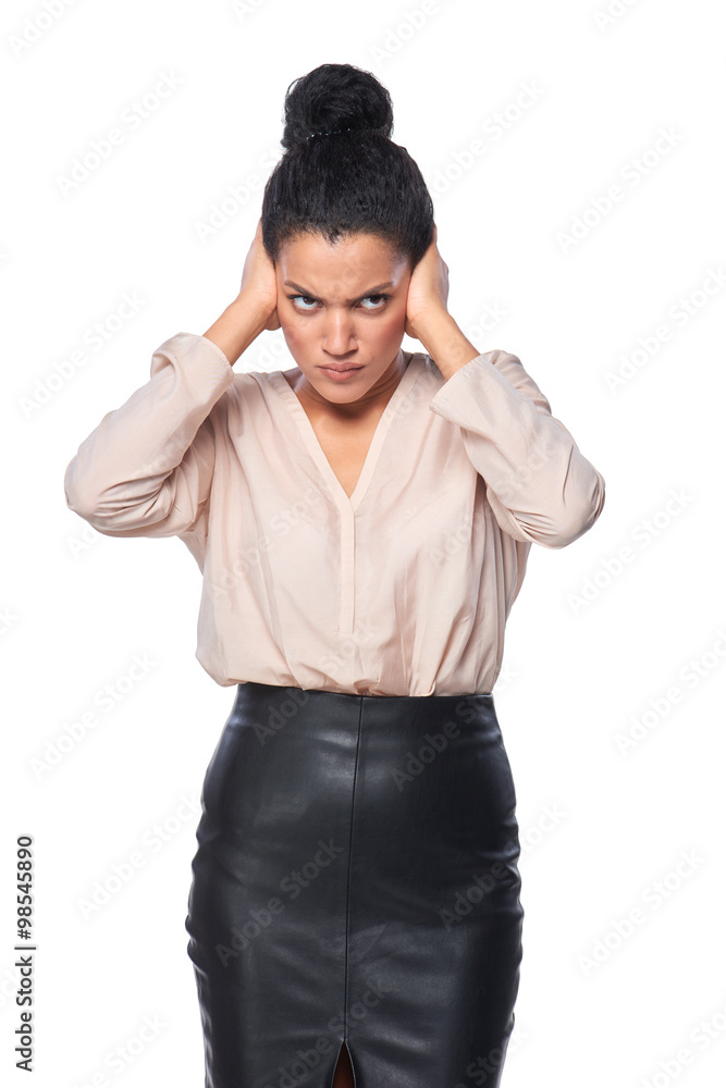 Displeased business woman with hands on ears Displeased business woman with hands on ears