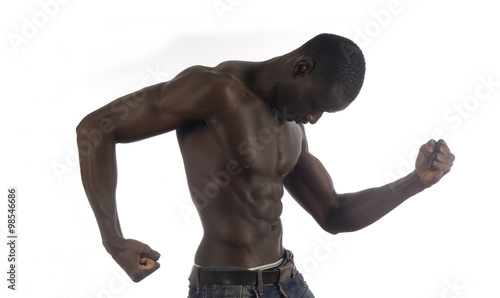 A black man with a muscular body and white background.