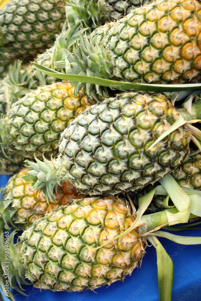 a lot of pineapple sell in market. a lot of pineapple sell in market.