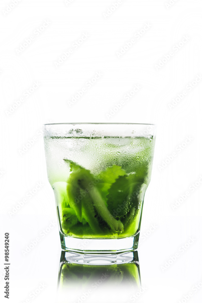 Green cocktail with kiwi slices isolated on white