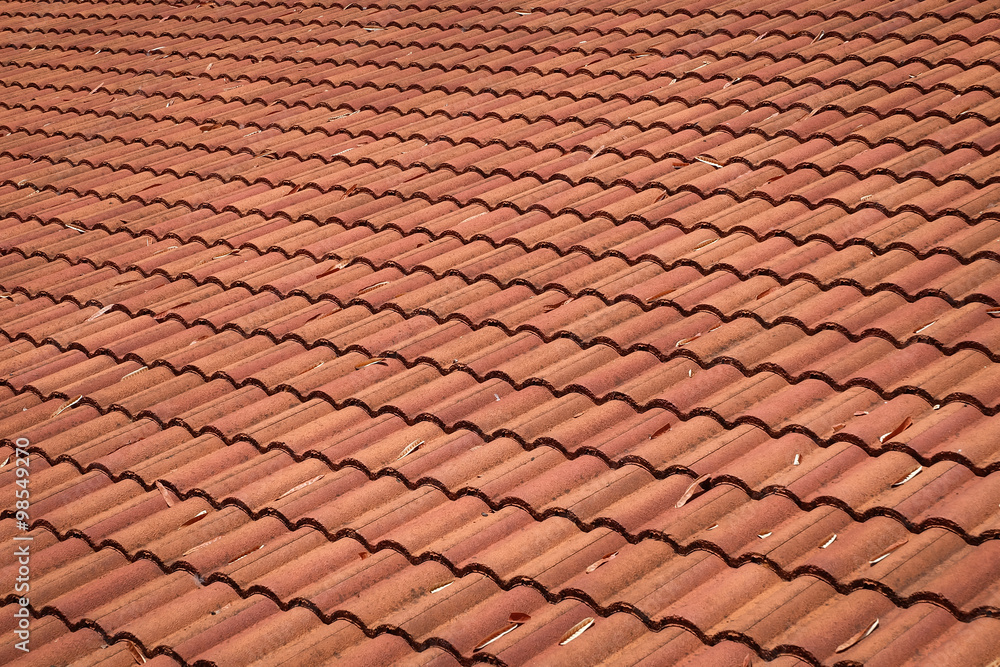 brown tile roof weathered on building residential