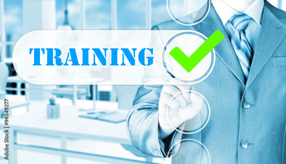 Businessman pressing touch screen interface training checkbox Businessman pressing touch screen interface training checkbox