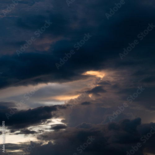 twilight sunset sky with cloudy and sunlight through clouds © sutichak