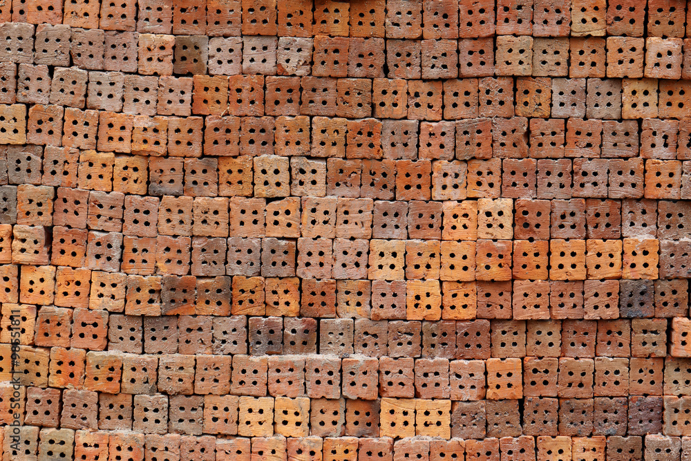 Stack of clay bricks texture background.