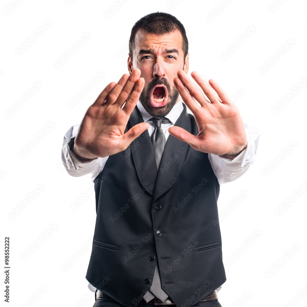 Businessman making stop sign Businessman making stop sign