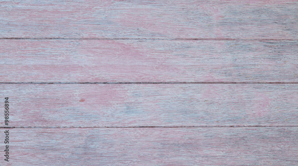 Naklejka premium Closeup of pale grey wooden horizontal planks with red and blue tints