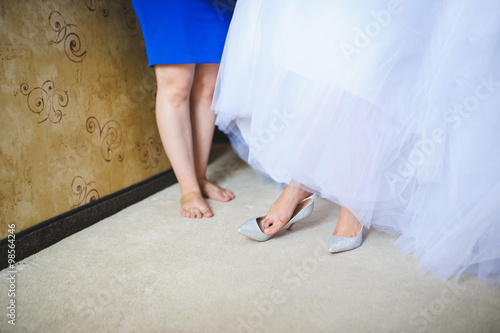 Bride Putting on Shoe