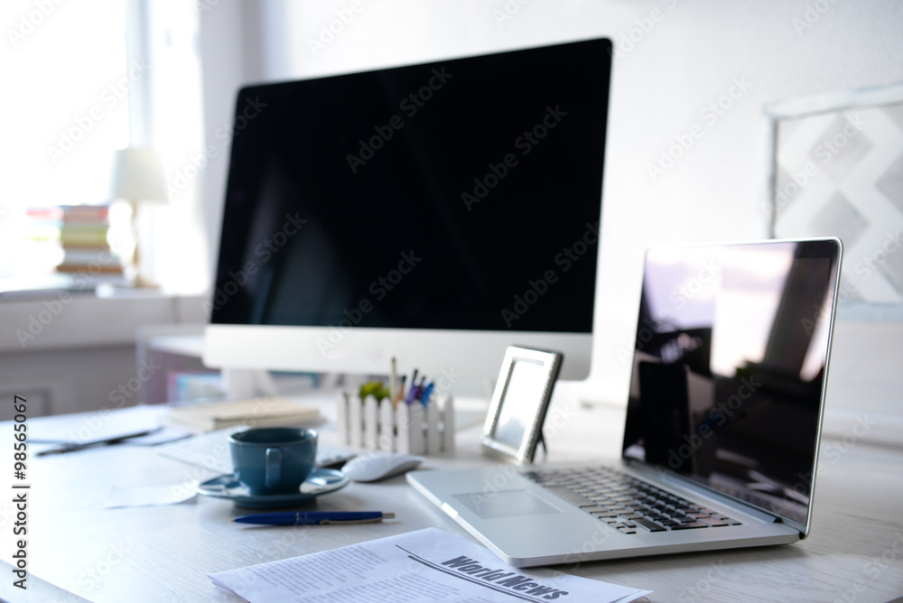 Workplace with computer and laptop on the table Workplace with computer and laptop on the table