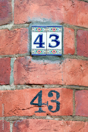 House number 43 tiles and painted