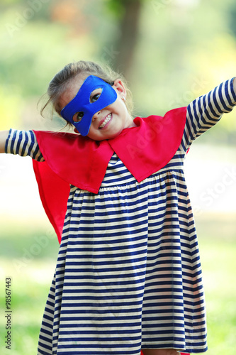 Happy little girl dressed a...