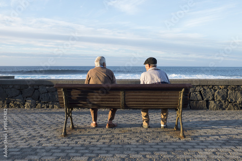 old people looking the sea