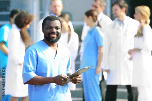 Handsome smiling doctor wit...