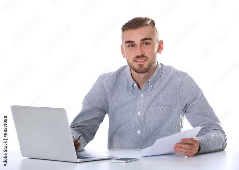 Businessman working with laptop on bright background Businessman working with laptop on bright background