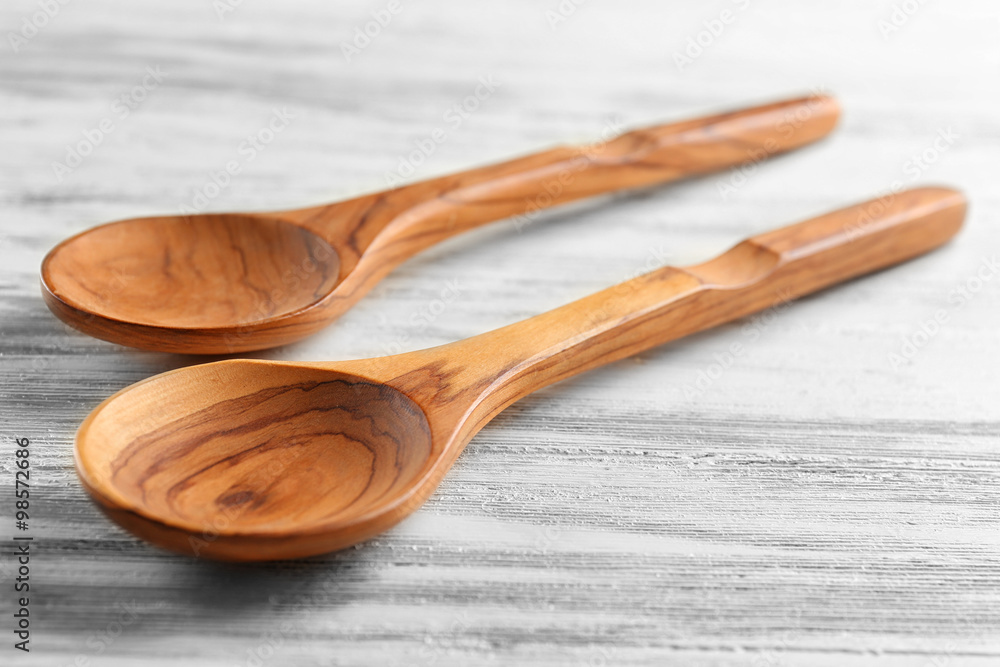 Two wooden spoons on the table, close-up Two wooden spoons on the table, close-up