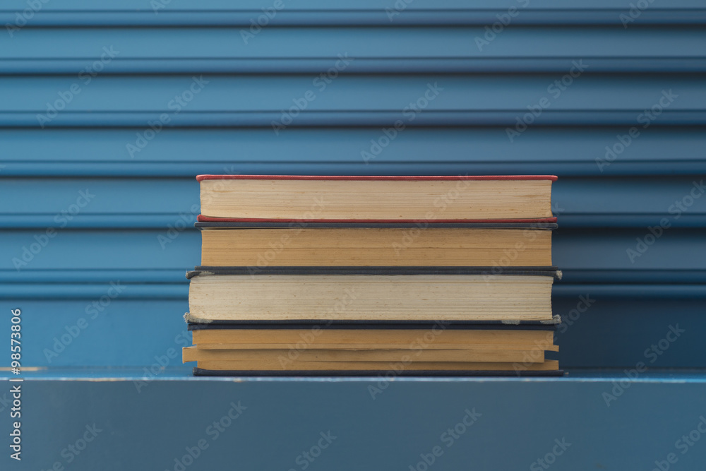 Fototapeta premium vintage books on blue background