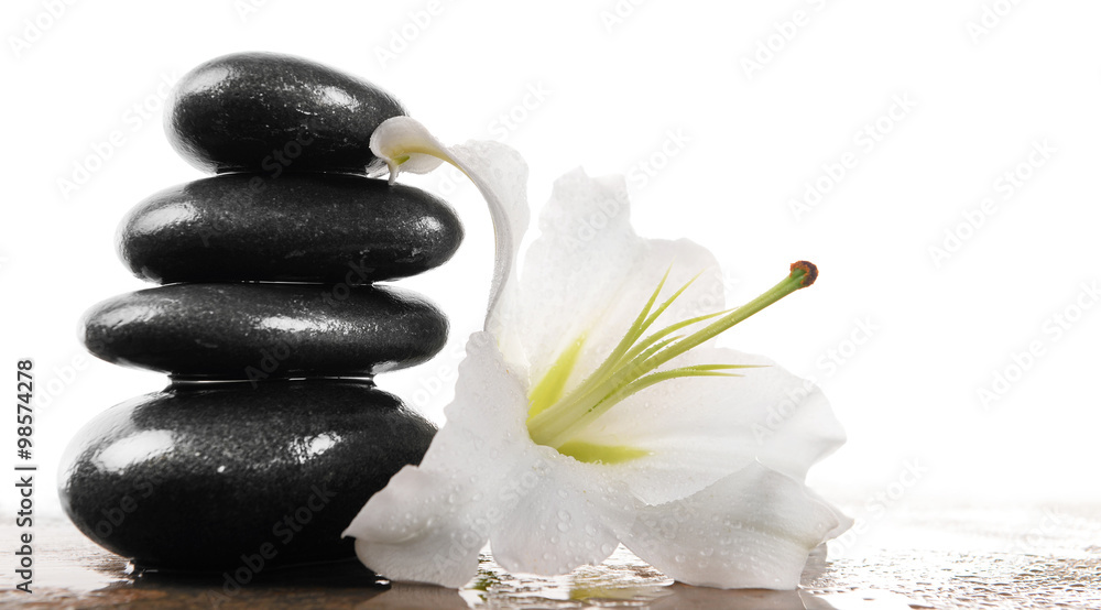 Fototapeta premium Spa stones with lily, isolated on white