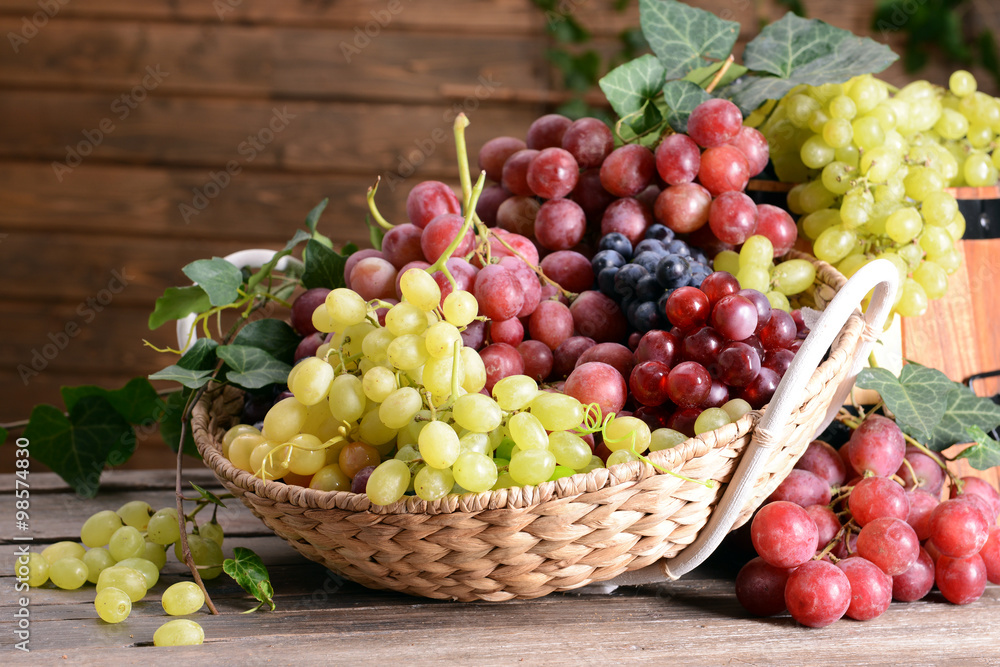 Grape in basket on wooden table Grape in basket on wooden table