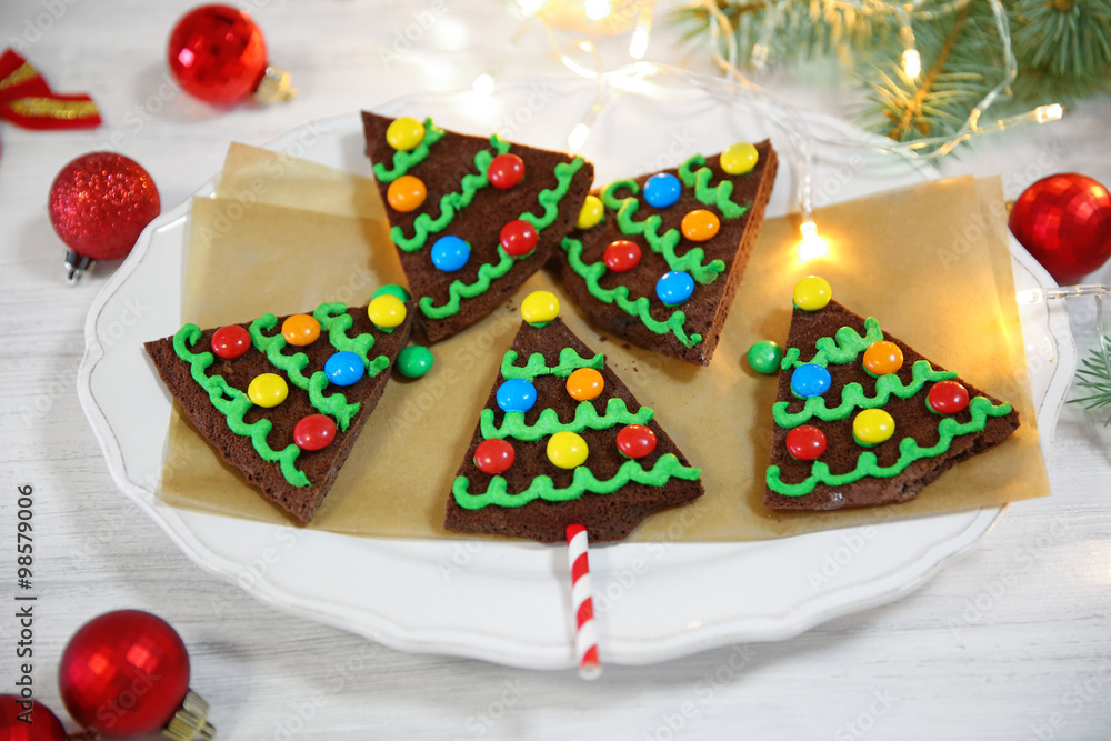 Delicious colorful Christmas cookies on plate with festive decoration Delicious colorful Christmas cookies on plate with festive decoration